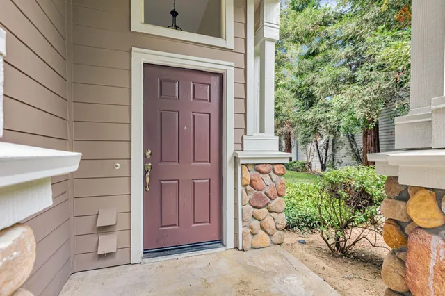 a view of a kitchen with wooden floor and entryway