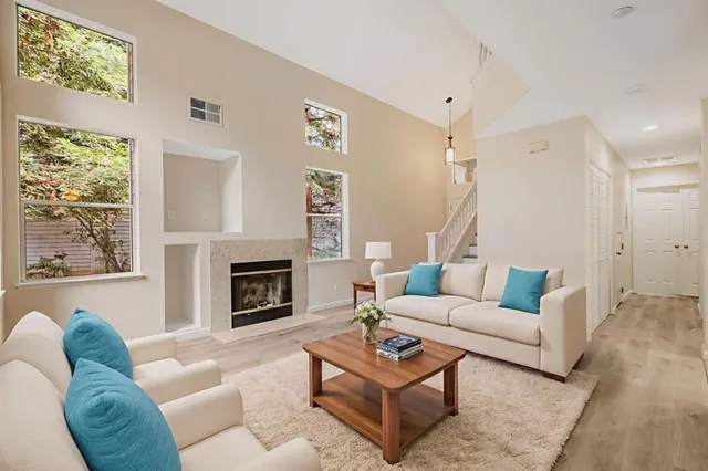 a kitchen with white cabinets and appliances