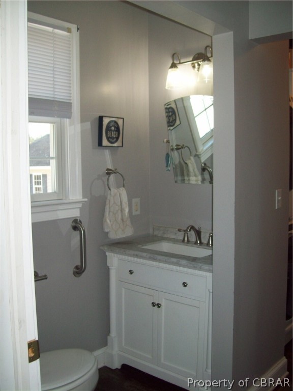 672 Lillys Neck Road Moon, VA 23119 - Photo 16 of 49 a bathroom with a toilet sink and mirror