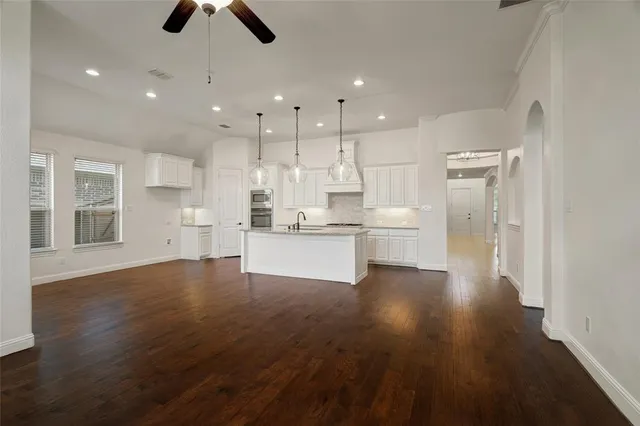 a view of kitchen with wooden floor and window