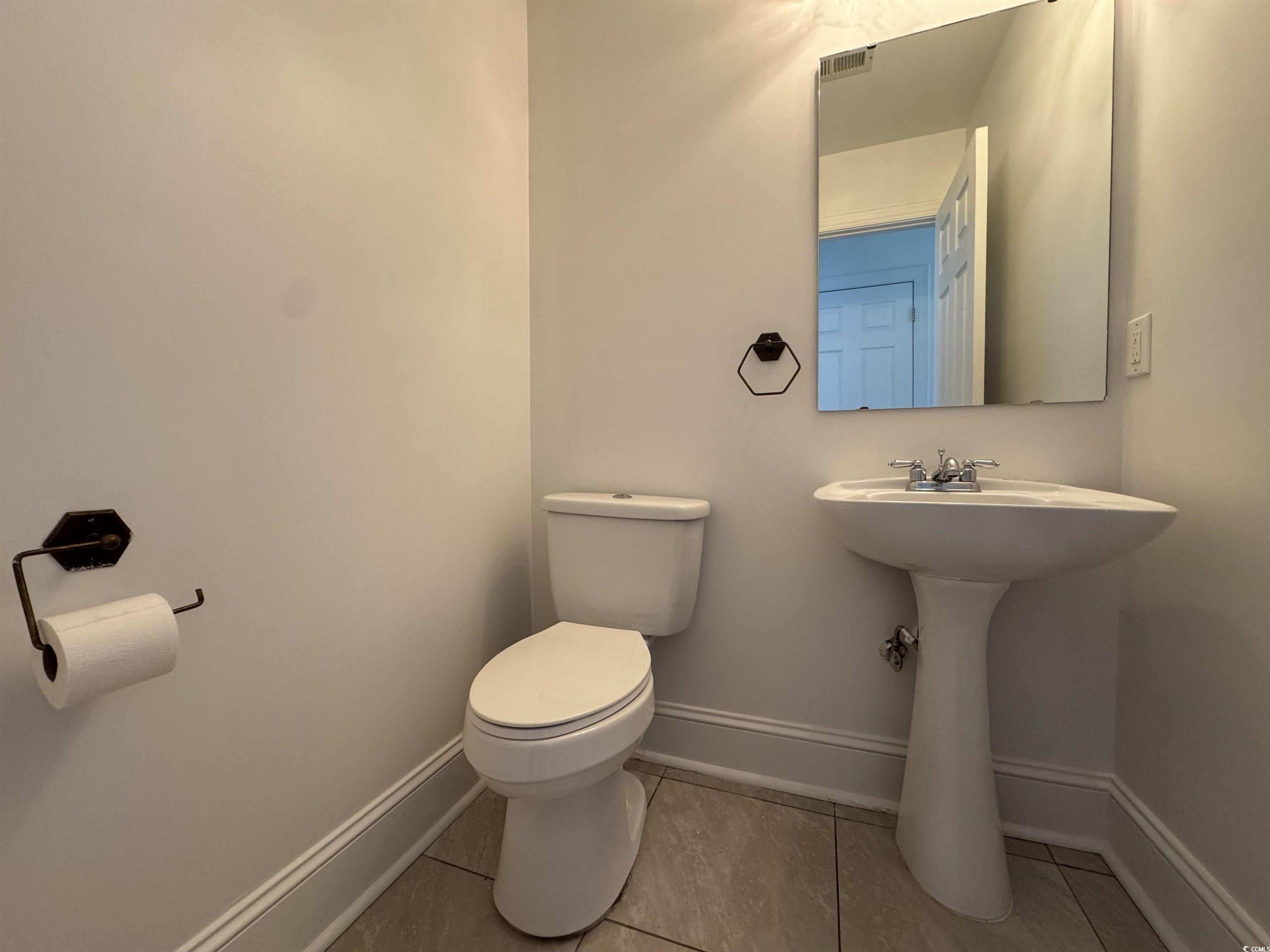 3848 Waterford Drive Myrtle Beach, SC 29577 - Photo 3 of 12 Half bath with baseboards and light tile patterned floors
