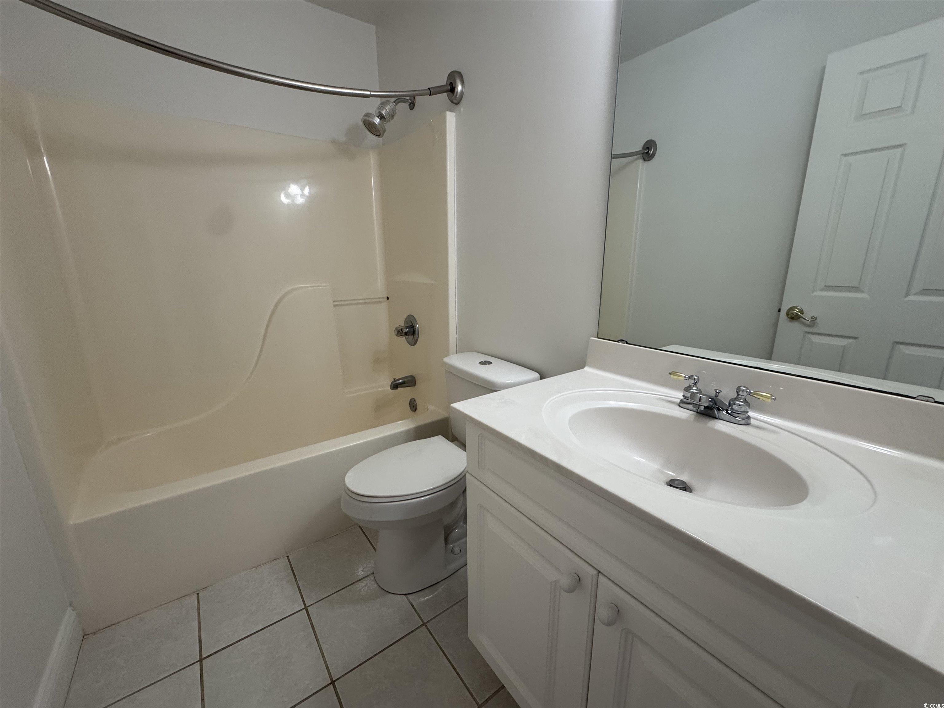 3848 Waterford Drive Myrtle Beach, SC 29577 - Photo 10 of 12 Bathroom featuring shower / bath combination, light tile patterned floors, and vanity