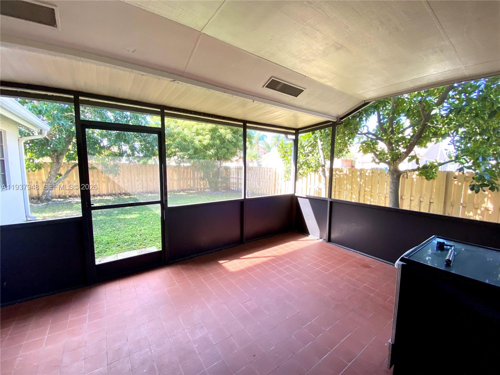1297 Southwest 151st Avenue Sunrise, FL 33326 - Photo 11 of 12 a view of an empty room with a large window