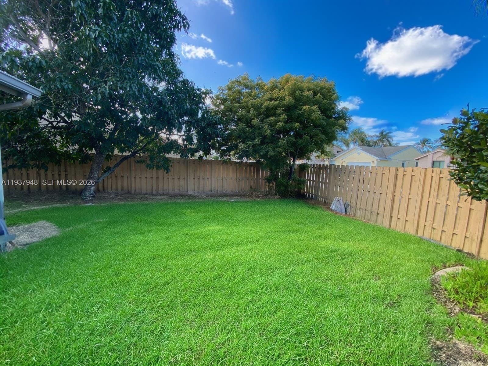 1297 Southwest 151st Avenue Sunrise, FL 33326 - Photo 12 of 12 a view of a back yard