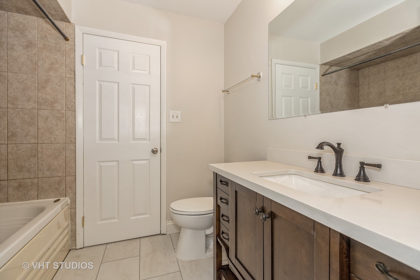 623 Quail Run Road Matteson, IL 60443 - Photo 12 of 16 a bathroom with a granite countertop sink a toilet and bathtub