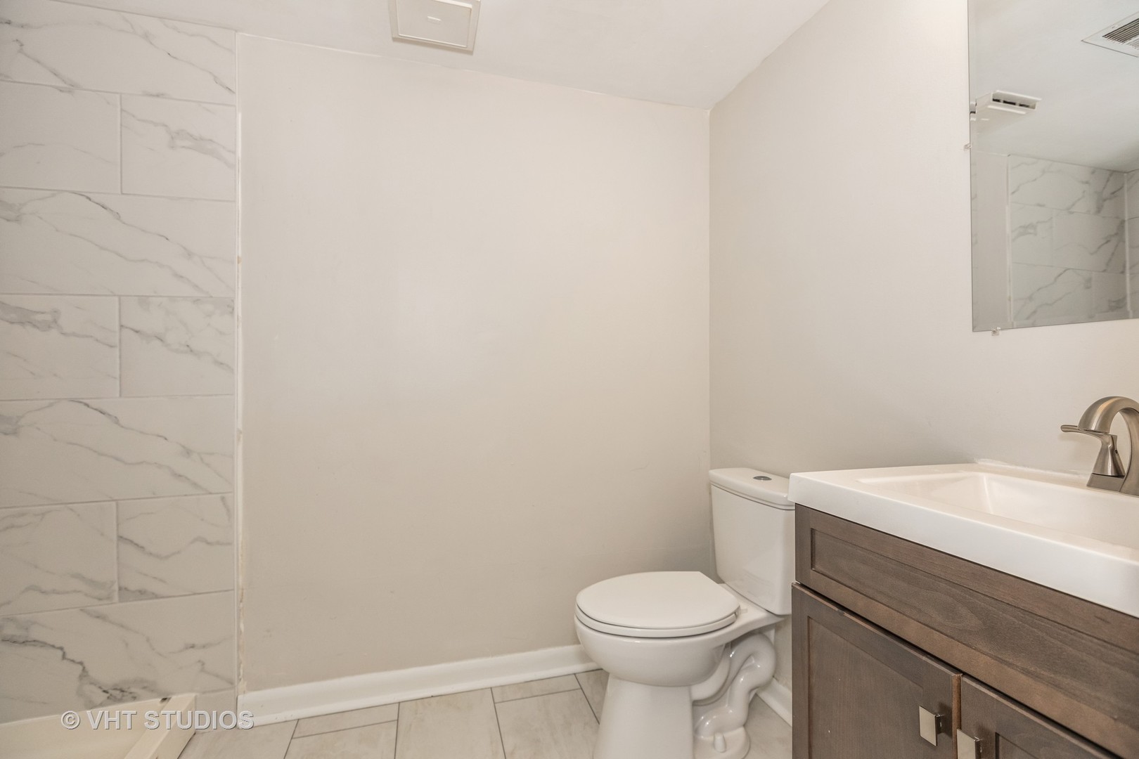 623 Quail Run Road Matteson, IL 60443 - Photo 13 of 16 a bathroom with a sink a toilet and mirror