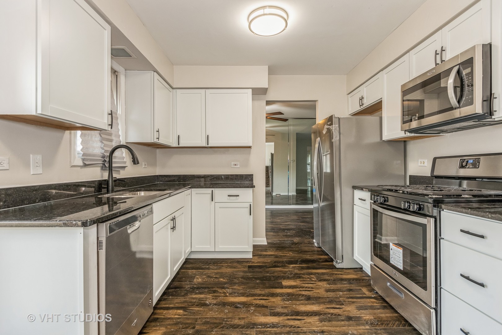 623 Quail Run Road Matteson, IL 60443 - Photo 3 of 16 a kitchen with stainless steel appliances granite countertop a stove sink and cabinets