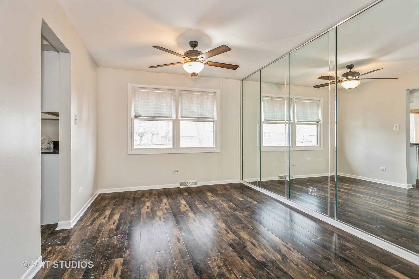 623 Quail Run Road Matteson, IL 60443 - Photo 5 of 16 wooden floor in an empty room with a window