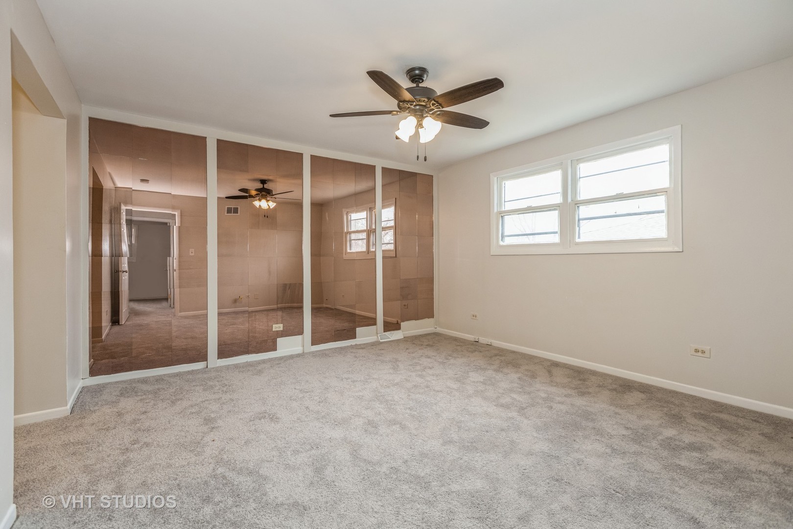 623 Quail Run Road Matteson, IL 60443 - Photo 7 of 16 an empty room with fan and windows