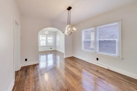 a view of a room with a dishwasher and a window