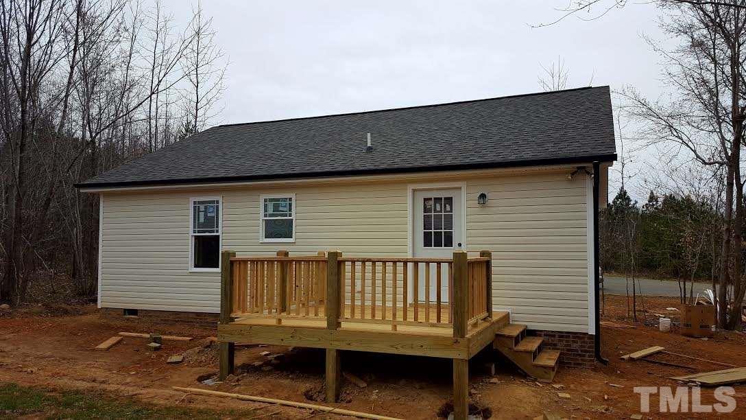 37 Eli Court Roxboro, NC 27573 - Photo 13 of 13 a backyard of a house with a deck