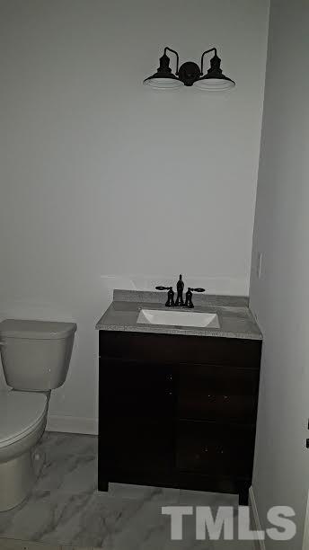 37 Eli Court Roxboro, NC 27573 - Photo 10 of 13 a bathroom with a sink and a toilet