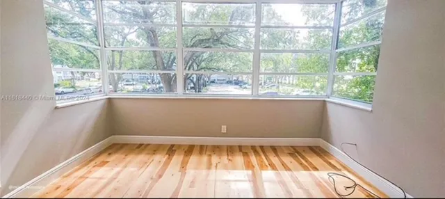 an empty room with a large window