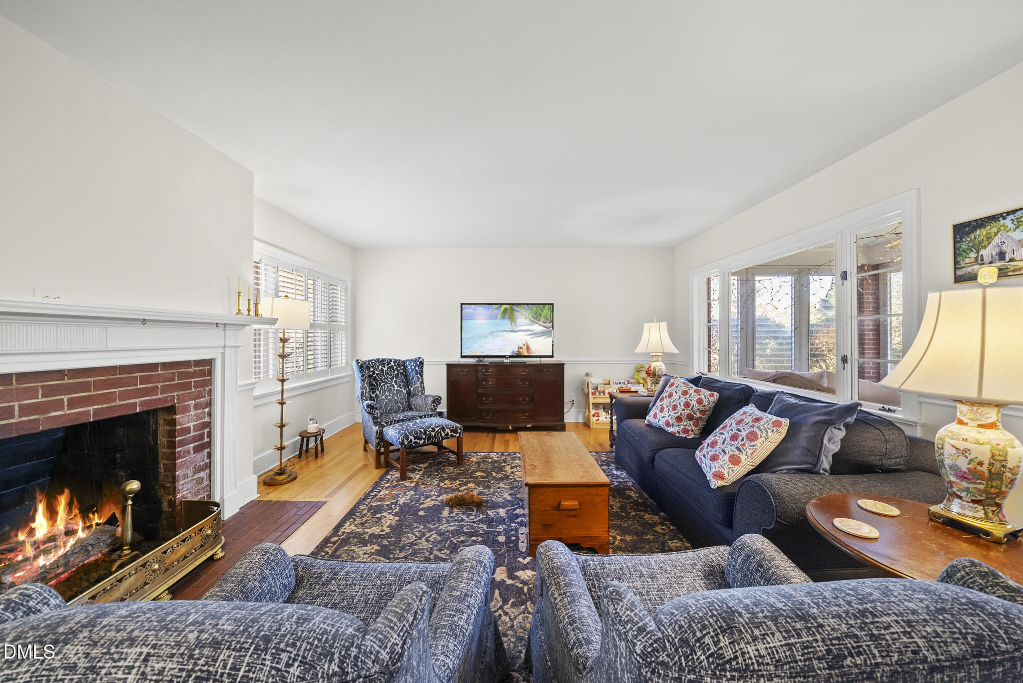 1108 Brooks Avenue Raleigh, NC 27607 - Photo 11 of 35 a living room with furniture and a fireplace
