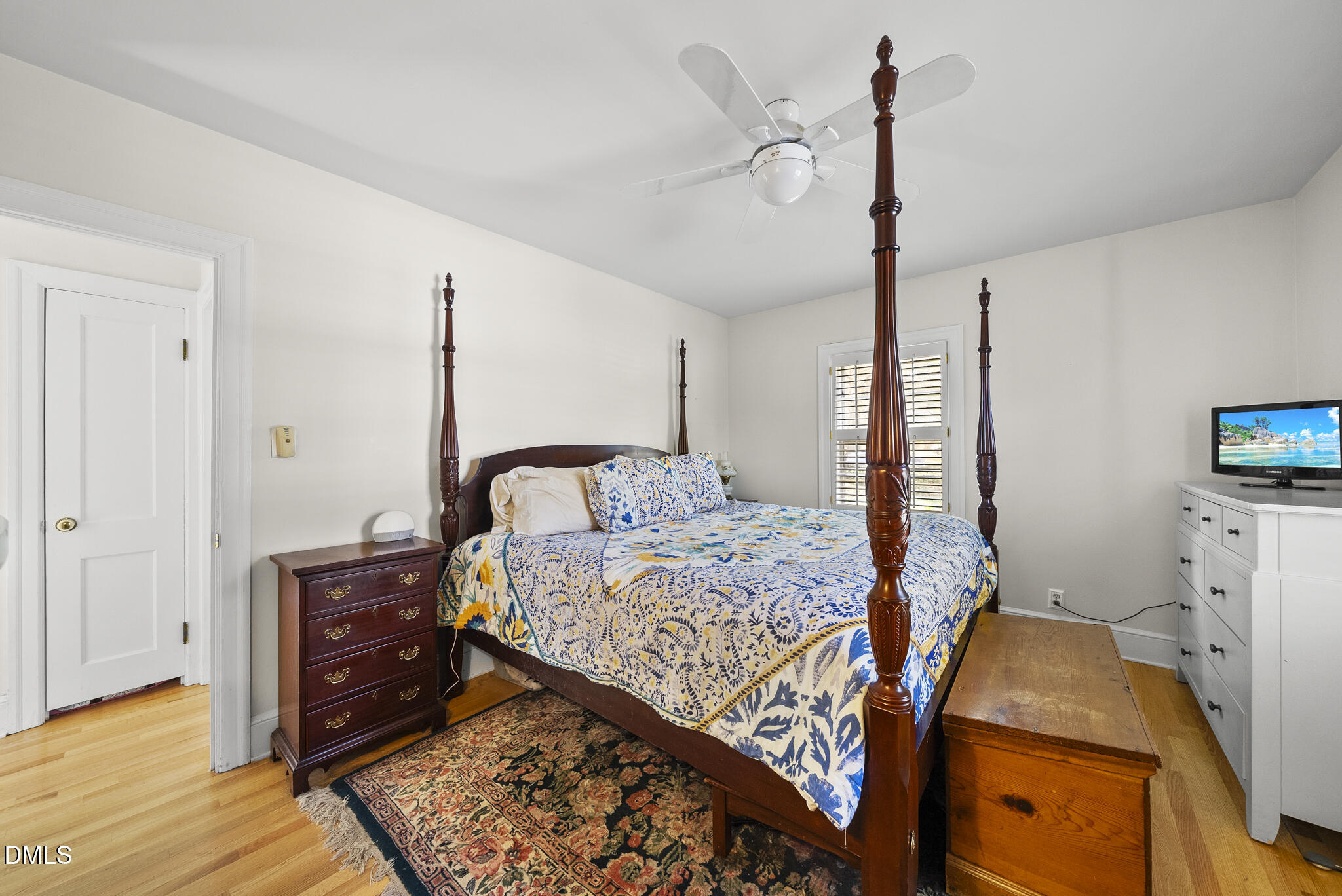 1108 Brooks Avenue Raleigh, NC 27607 - Photo 12 of 35 a bedroom with a bed and a dresser in it