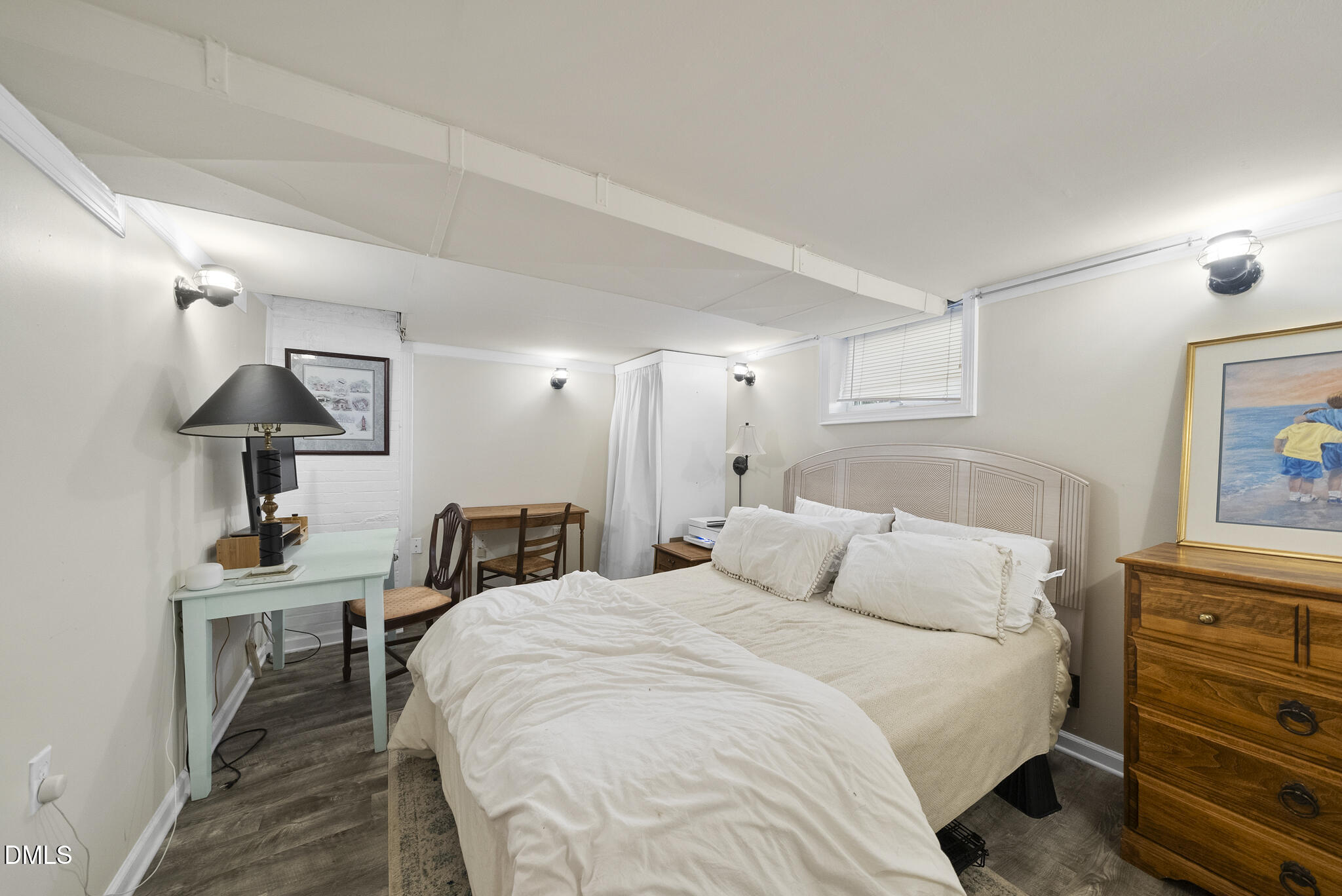 1108 Brooks Avenue Raleigh, NC 27607 - Photo 20 of 35 a bedroom with a bed and a lamp on table