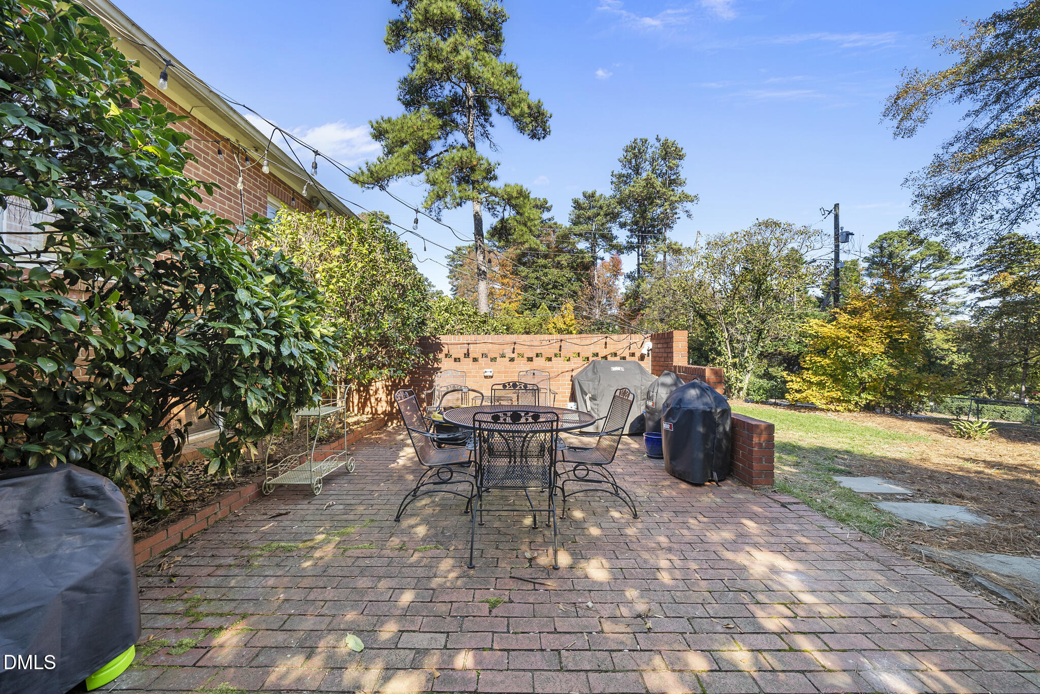 1108 Brooks Avenue Raleigh, NC 27607 - Photo 28 of 35 a view of a tables and chairs in back yard of the house