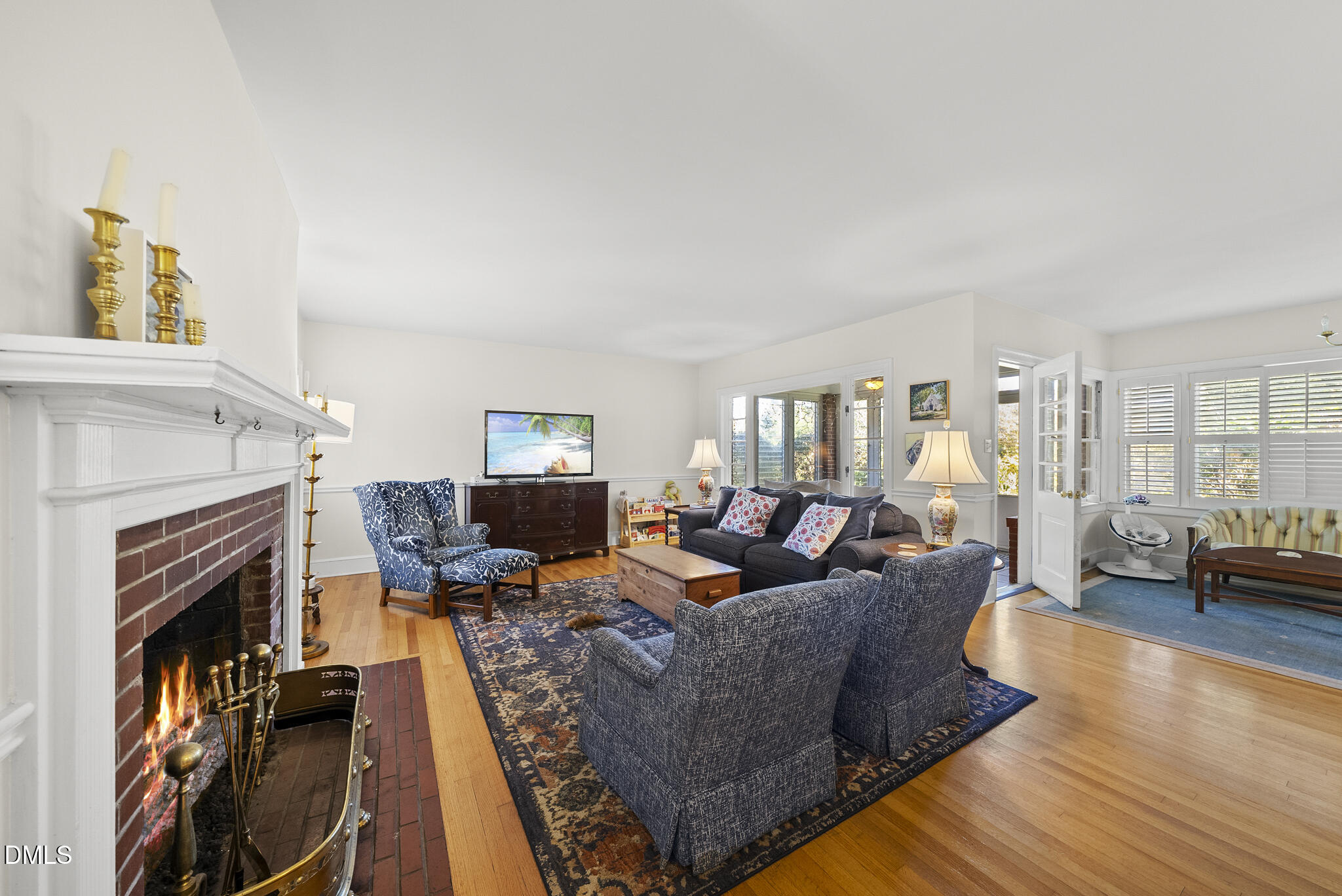 1108 Brooks Avenue Raleigh, NC 27607 - Photo 3 of 35 a living room with fireplace furniture and a wooden floor