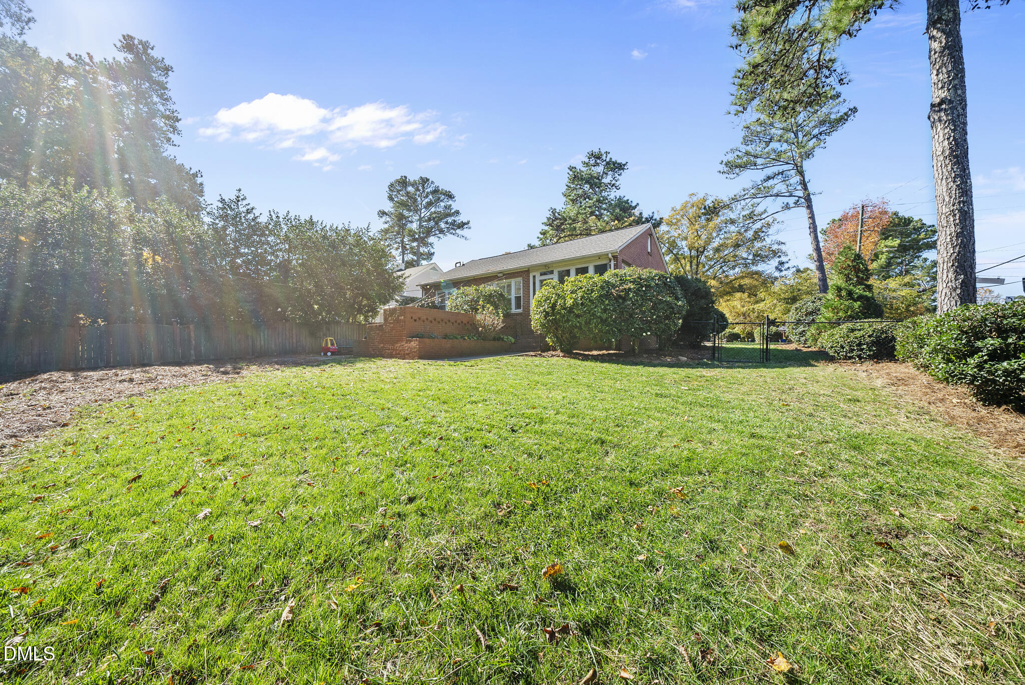 1108 Brooks Avenue Raleigh, NC 27607 - Photo 31 of 35 a view of a garden with a building in the background