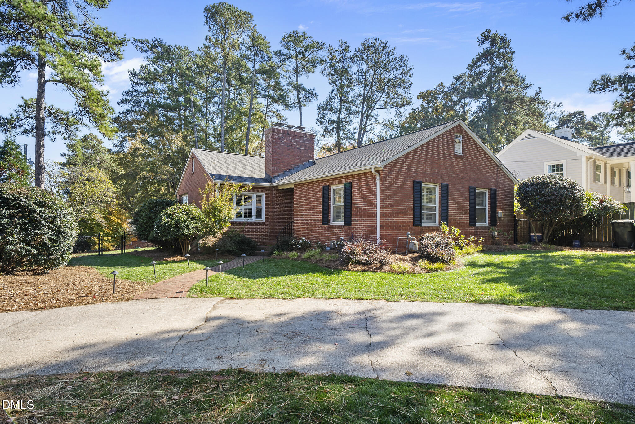 1108 Brooks Avenue Raleigh, NC 27607 - Photo 34 of 35 a front view of a house with a yard and outdoor seating