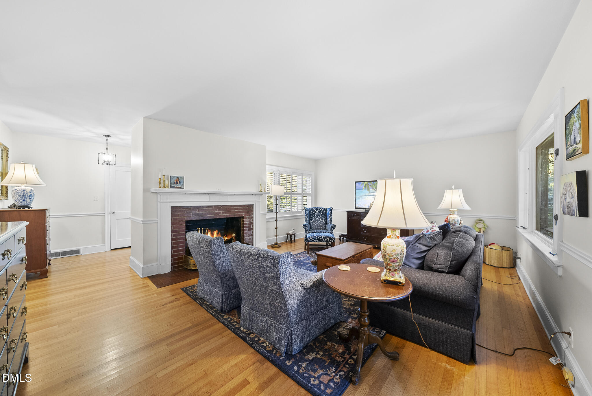 1108 Brooks Avenue Raleigh, NC 27607 - Photo 4 of 35 a living room with furniture and a fireplace