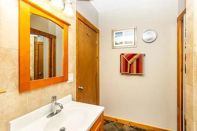a bathroom with a sink and a mirror