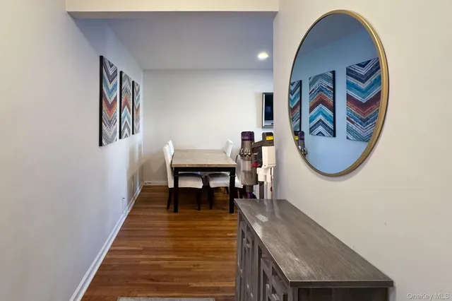 a view of hallway with wooden floor