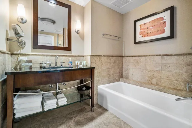 a bathroom with a bathtub and a sink