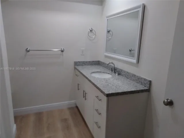 a view of a house with a yard and a patio