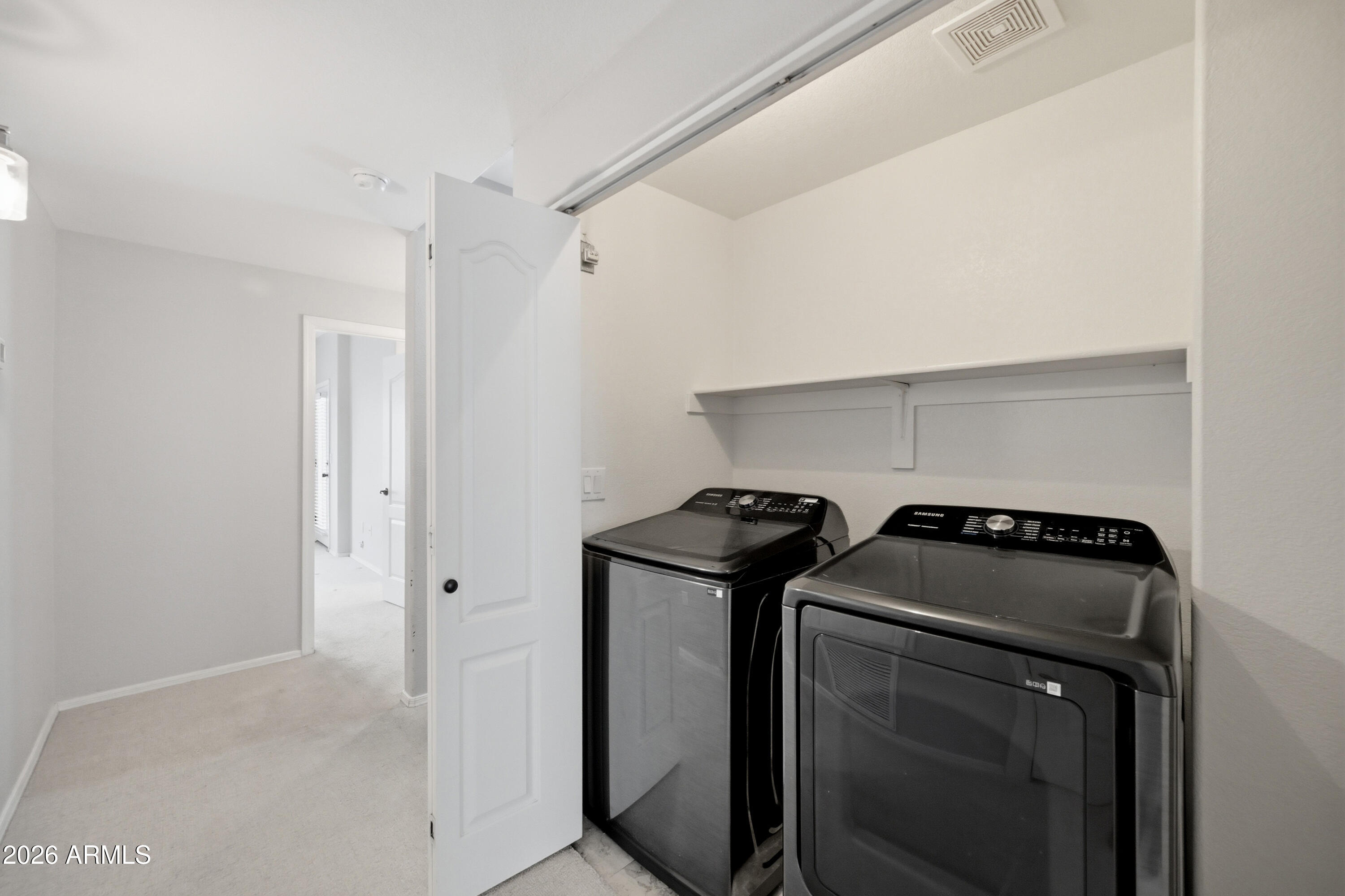 3150 East Beardsley Road, Unit 1009 Phoenix, AZ 85050 - Photo 22 of 31 a utility room with dryer and washer