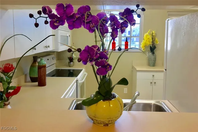 a bathroom with a sink mirror and vanity