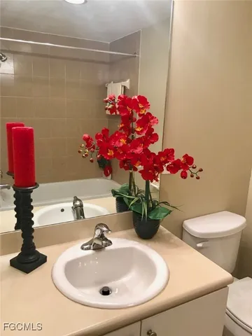 a bathroom with a sink toilet and a shower