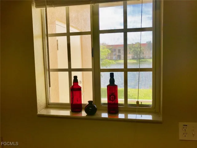 a view of empty room with floor to ceiling windows
