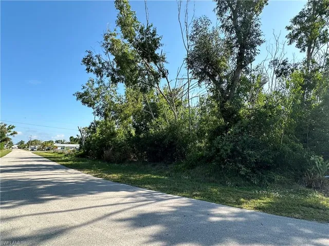 a view of path along with green space