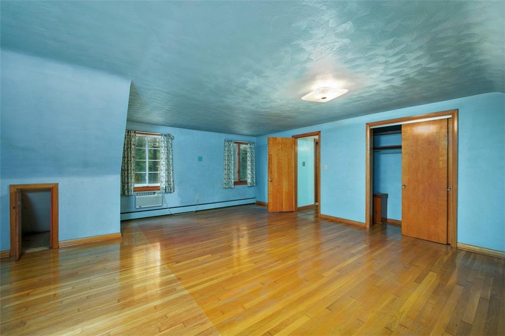 5572 Sandy Lake Polk Road Sandy Lake, PA 16145 - Photo 11 of 36 a view of an empty room with window and wooden floor