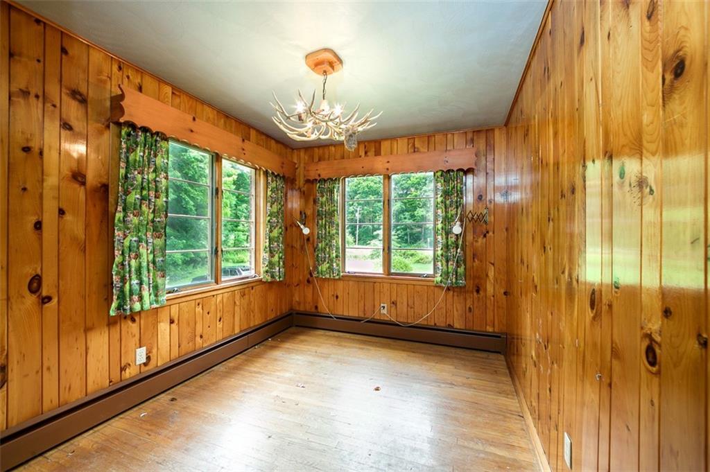 5572 Sandy Lake Polk Road Sandy Lake, PA 16145 - Photo 14 of 36 a view of a room with large windows