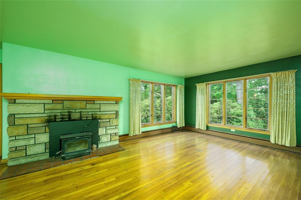 5572 Sandy Lake Polk Road Sandy Lake, PA 16145 - Photo 2 of 36 a view of an empty room with a fireplace and a window