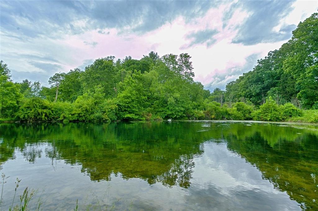 5572 Sandy Lake Polk Road Sandy Lake, PA 16145 - Photo 25 of 36 a view of a lake from a yard