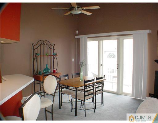 635 Edpas Road New Brunswick, NJ 08901 - Photo 3 of 10 a view of a dining room with furniture window and wooden floor