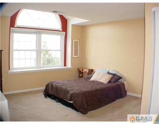 635 Edpas Road New Brunswick, NJ 08901 - Photo 7 of 10 a bedroom with a bed and a window
