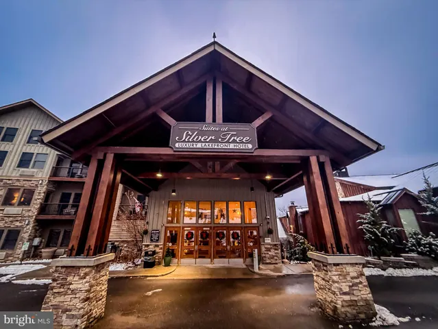 a view of a patio with table and chairs with wooden floor and plants