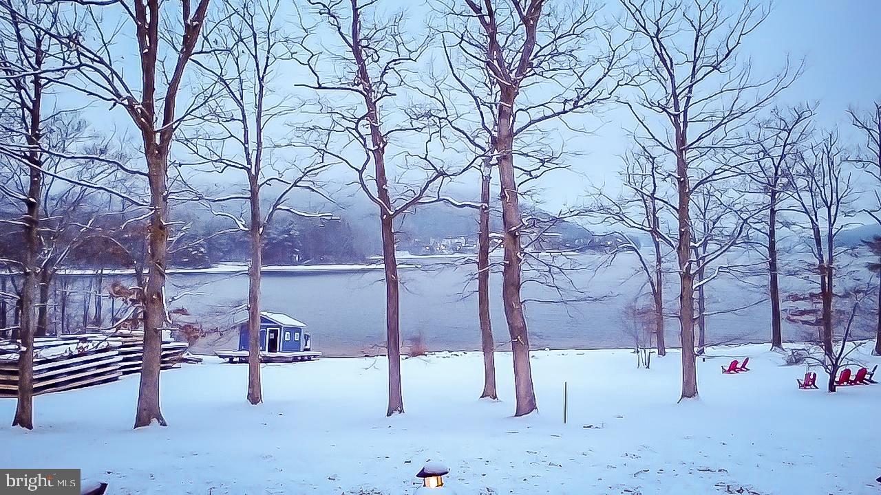565 Glendale Road, Unit B206 Oakland, MD 21550 - Photo 27 of 32 Serene winter landscape by the lake.