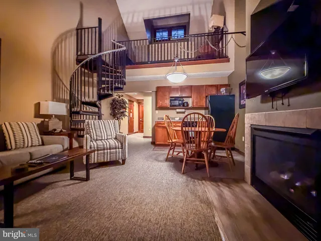 a dining room with furniture and a fireplace