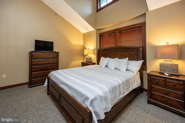 a bedroom with a bed and furniture