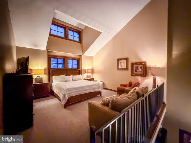 a bedroom with furniture and a couch