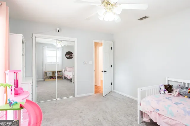 a bedroom with furniture and a chandelier