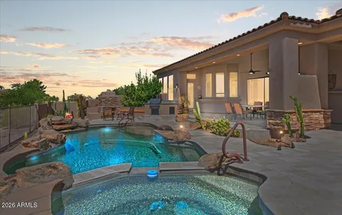a swimming pool with outdoor seating and yard