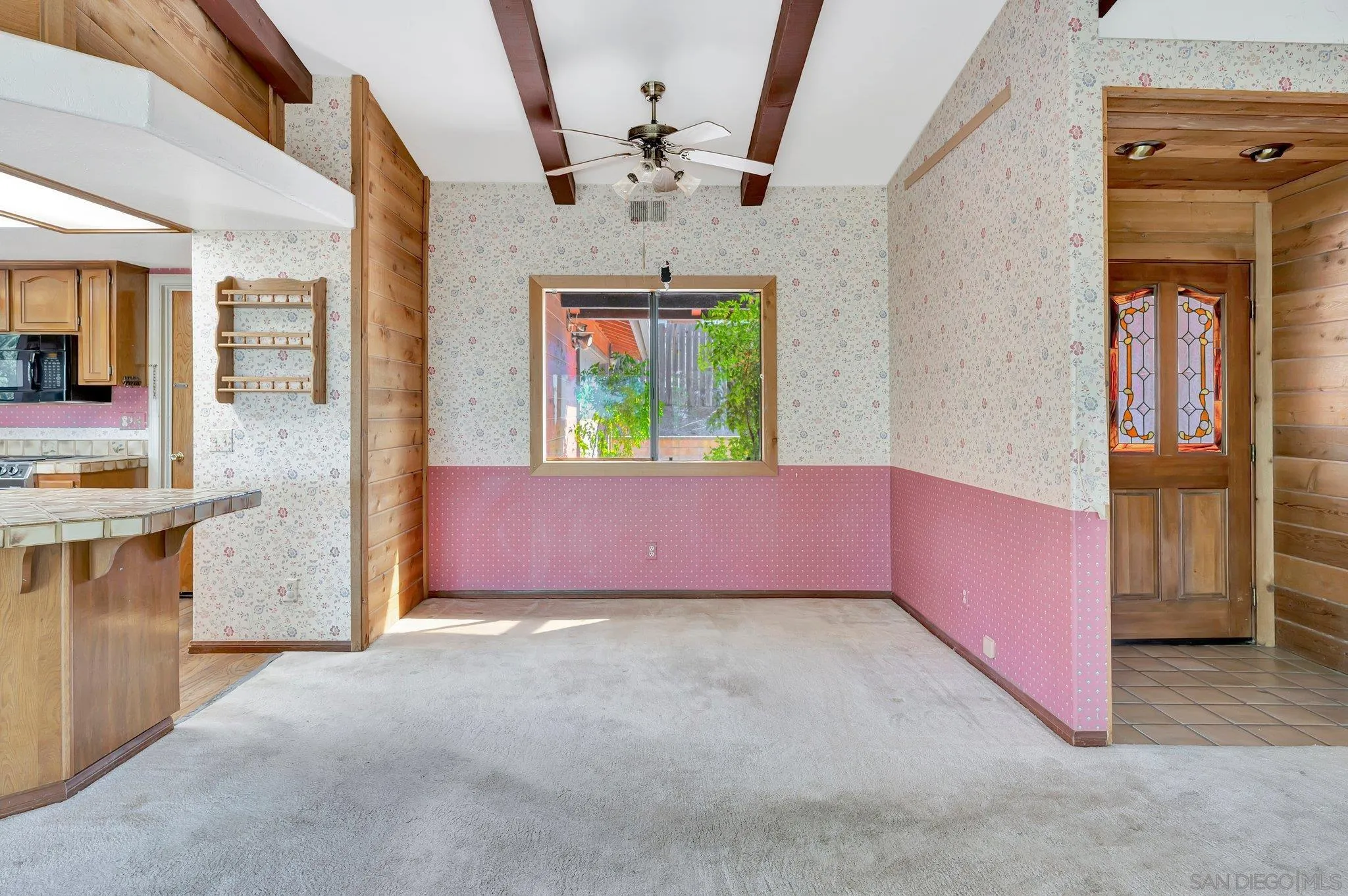 2596 Valetta Lane Alpine, CA 91901 - Photo 11 of 48 an empty room with a fireplace and a chandelier