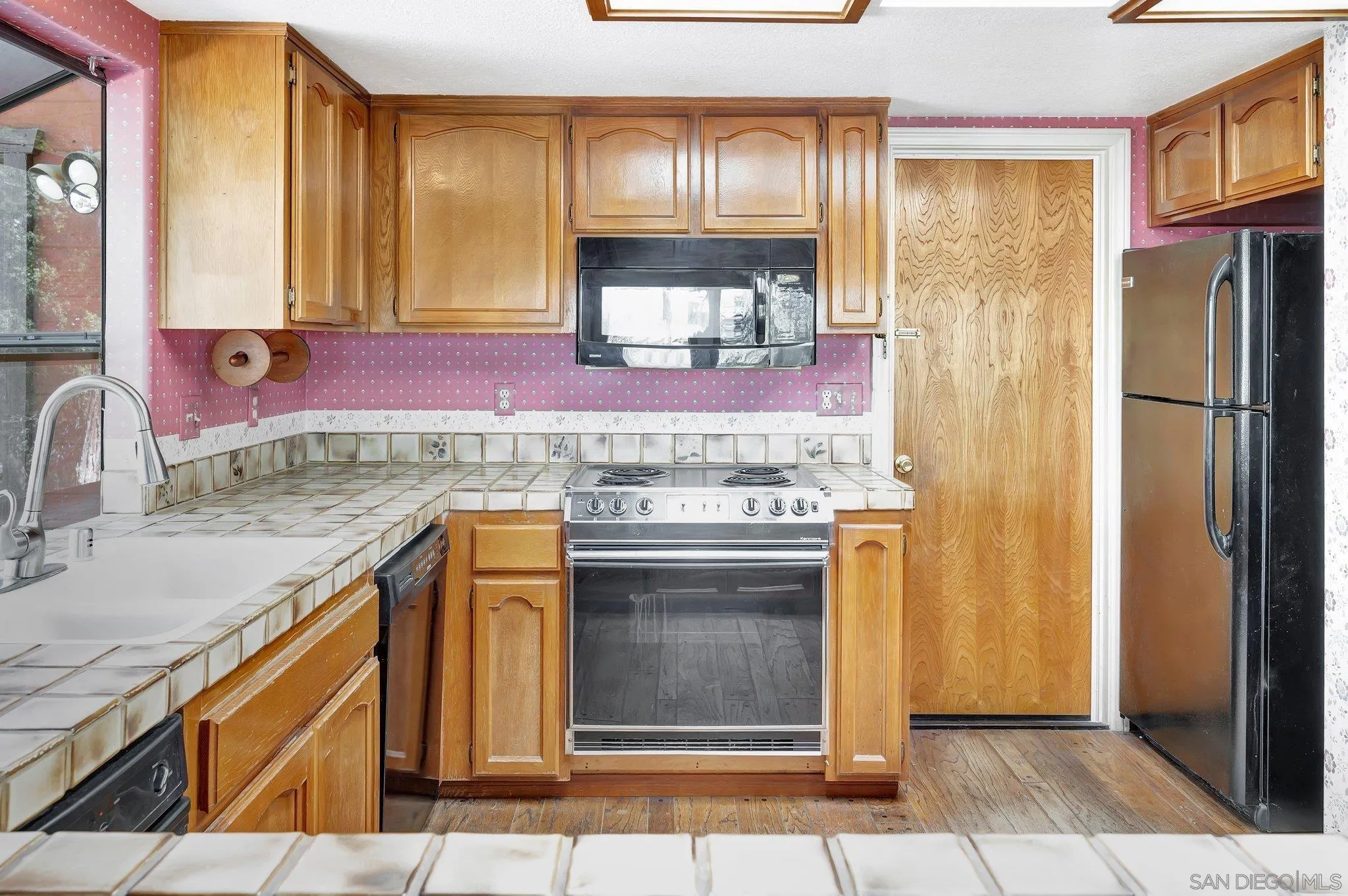 2596 Valetta Lane Alpine, CA 91901 - Photo 15 of 48 a kitchen with stainless steel appliances granite countertop a refrigerator and a sink