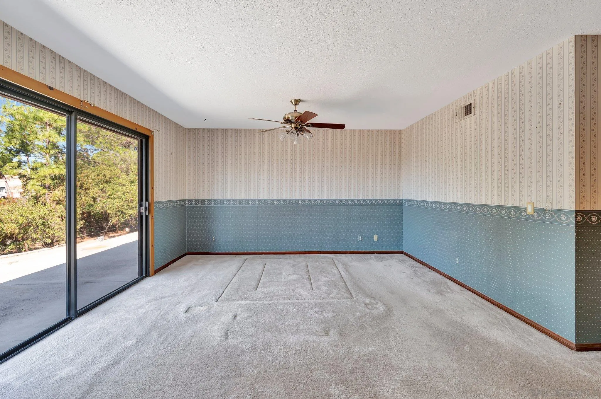 2596 Valetta Lane Alpine, CA 91901 - Photo 18 of 48 a view of a livingroom with a ceiling fan and window